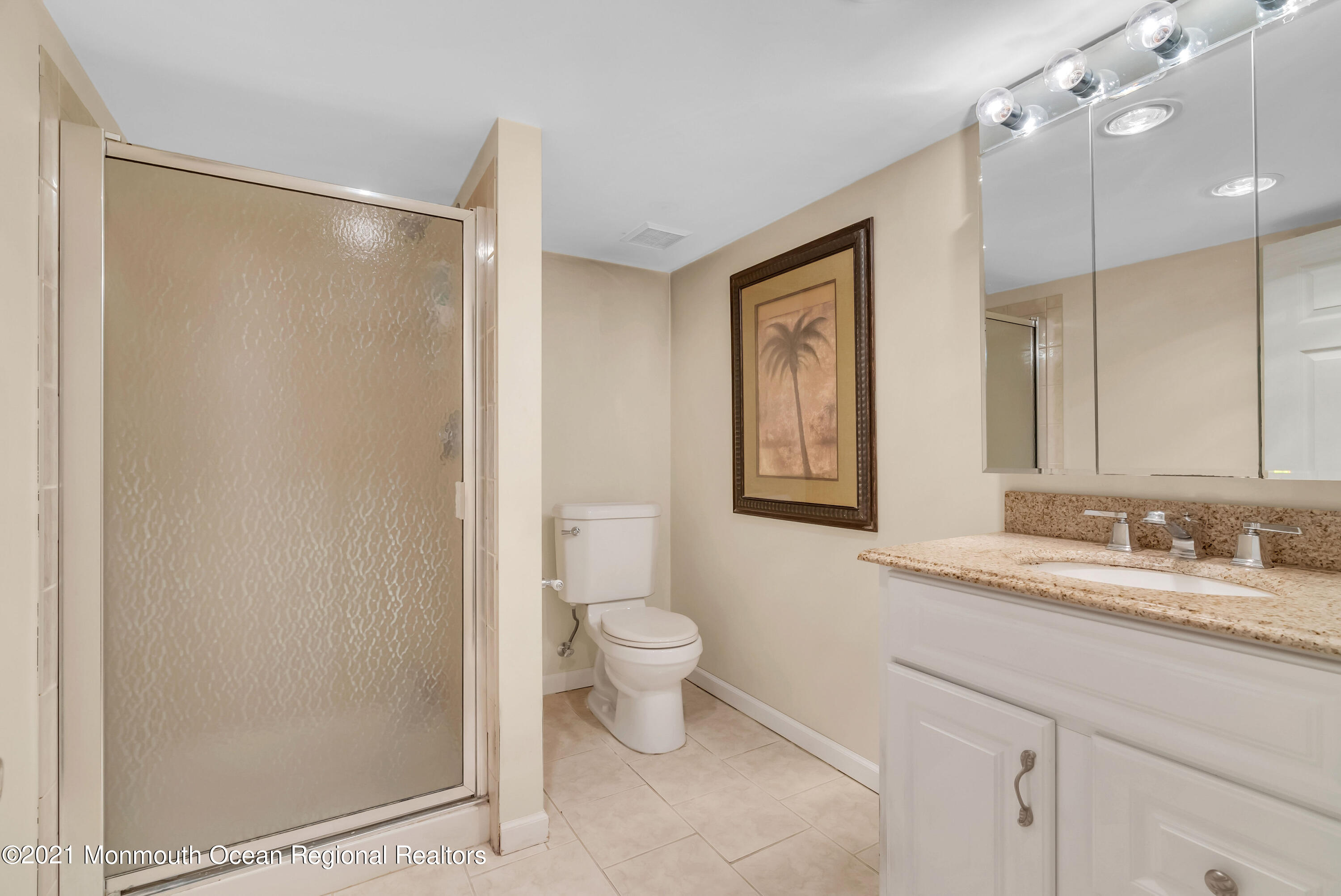 128 Whalepond Road Oakhurst, NJ 07755 - Photo 27 of 33 a bathroom with a granite countertop sink toilet and shower