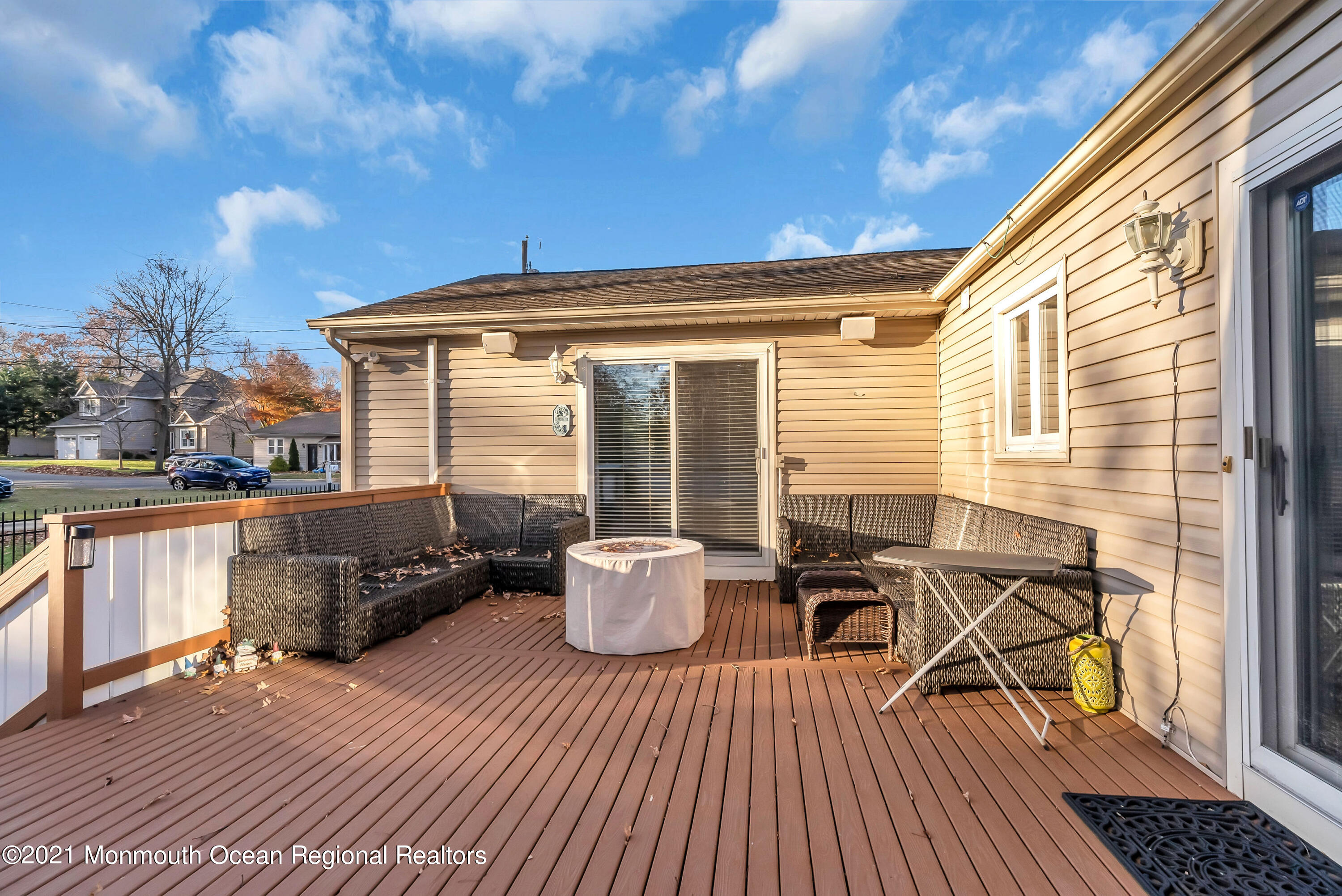 128 Whalepond Road Oakhurst, NJ 07755 - Photo 29 of 33 a balcony with furniture and wooden floor