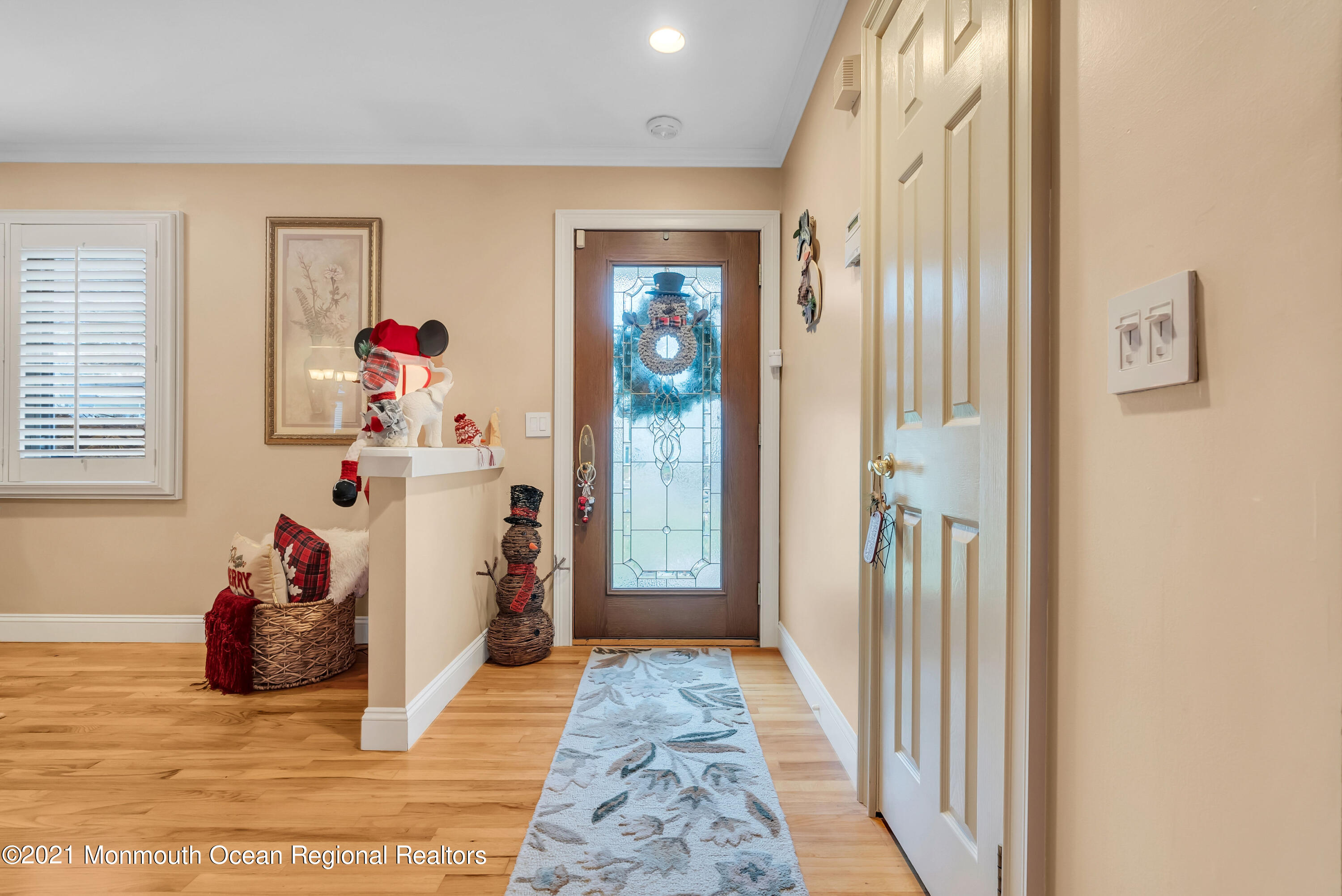 128 Whalepond Road Oakhurst, NJ 07755 - Photo 4 of 33 a view of a hallway to a livingroom with toys