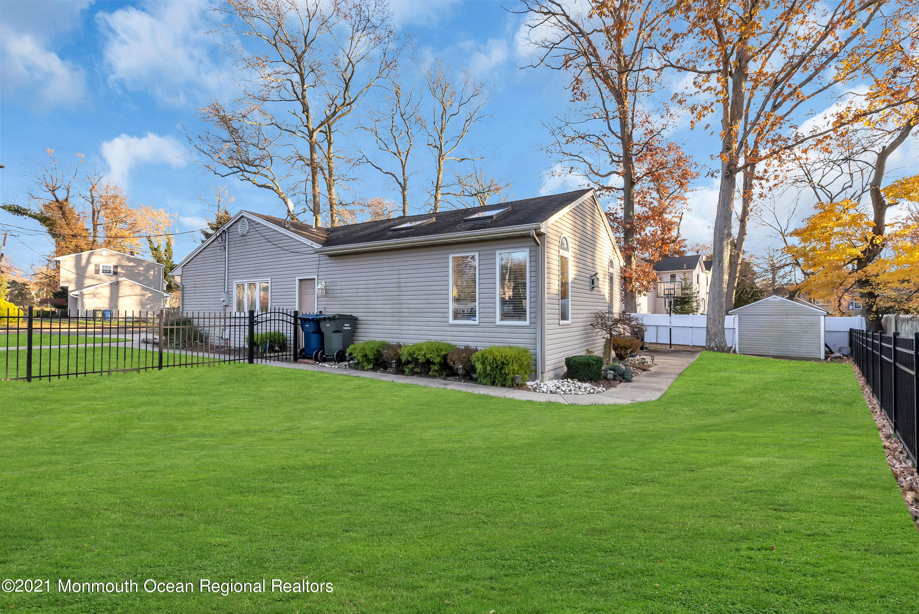 128 Whalepond Road Oakhurst, NJ 07755 - Photo 32 of 33 a view of an house with backyard space and garden