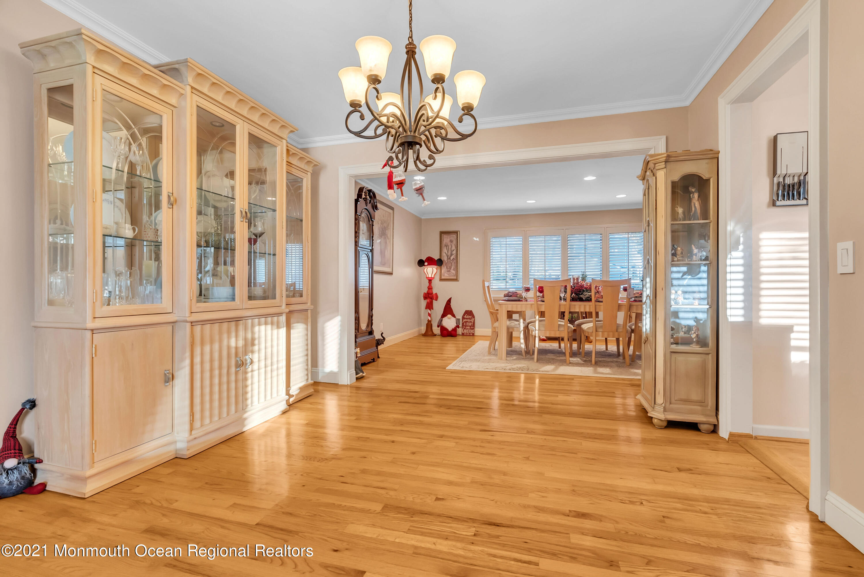 128 Whalepond Road Oakhurst, NJ 07755 - Photo 7 of 33 a view of a livingroom with furniture a dinning room and chandelier