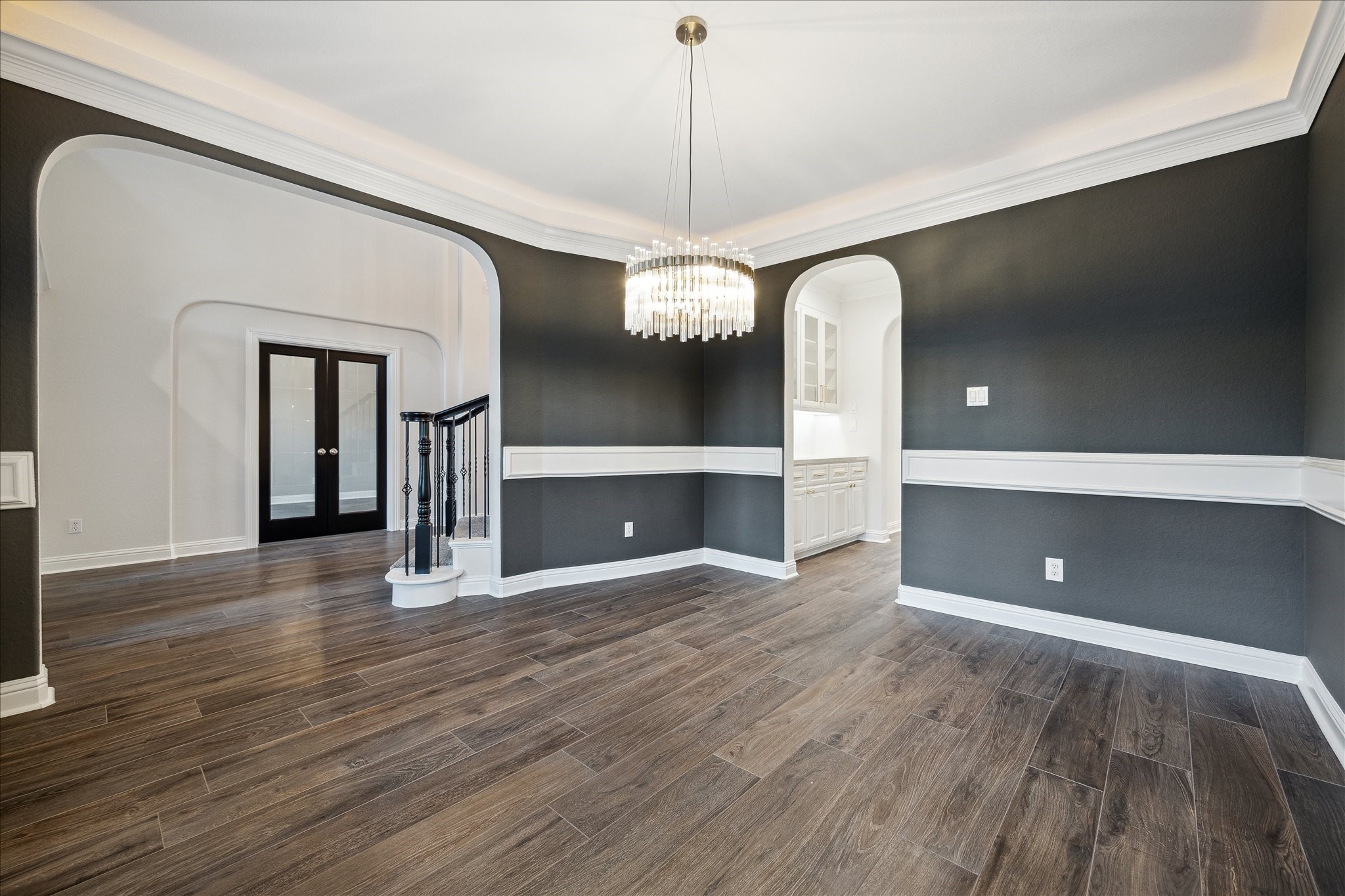6211 Alameda Point Lane Houston, TX 77041 - Photo 7 of 50 Open-concept living and dining with wood-look tile flooring and a layout thoughtfully designed for entertaining, featuring a private study with French doors just across the way and easy access to the chef's kitchen.