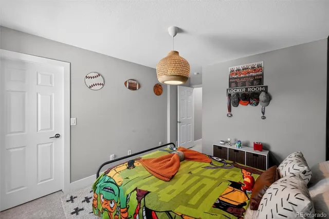 a bedroom with bed and the window