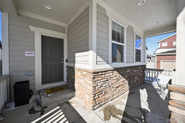 a view of an outdoor kitchen with seating area