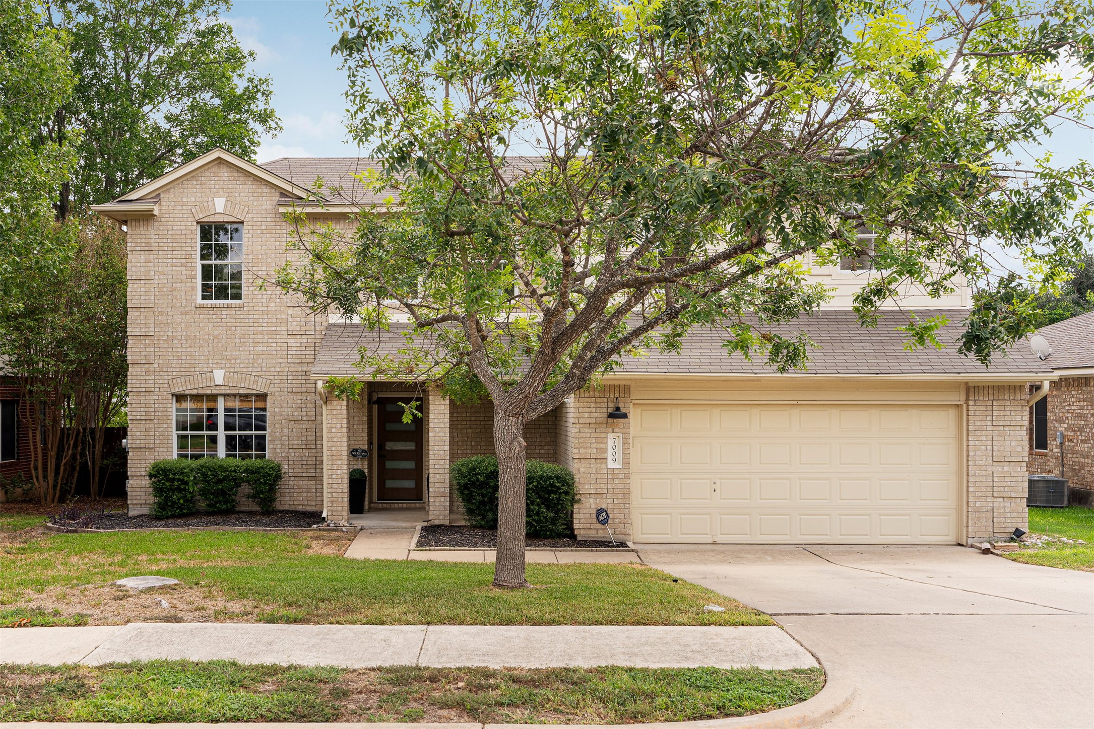 7009 Wandering Oak Road Austin, TX 78749 - Photo 7 of 36 Welcome to Woods Legend Oaks, where two-story single-family charm meets mature shade trees and quiet streets