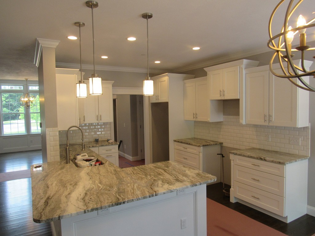 58 Ridge View Road Northampton, MA 01062 - Photo 7 of 15 a kitchen with kitchen island granite countertop a sink appliances and cabinets