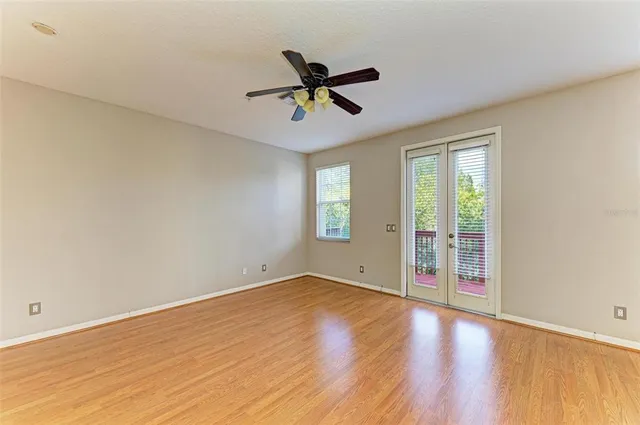 a balcony with wooden floor and outdoor space
