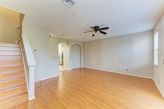 a bathroom with a granite countertop sink toilet mirror and shower