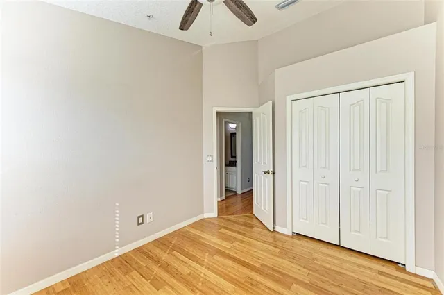 a view of hallway with wooden floor