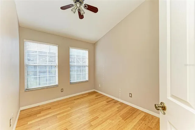a bathroom with a granite countertop sink shower and a mirror