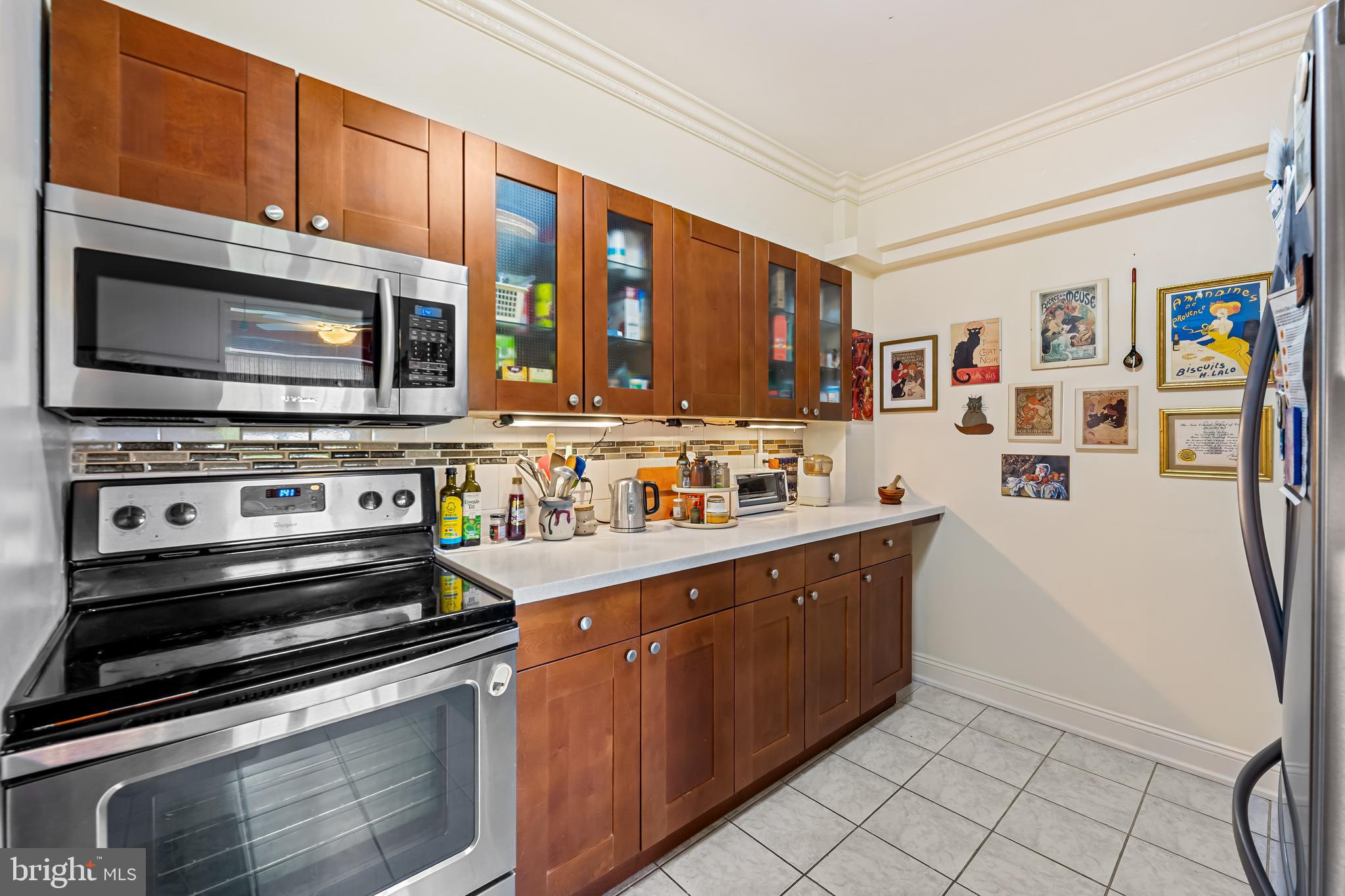 3601 Greenway, Unit 705 Baltimore, MD 21218 - Photo 11 of 30 a kitchen with stainless steel appliances and cabinets