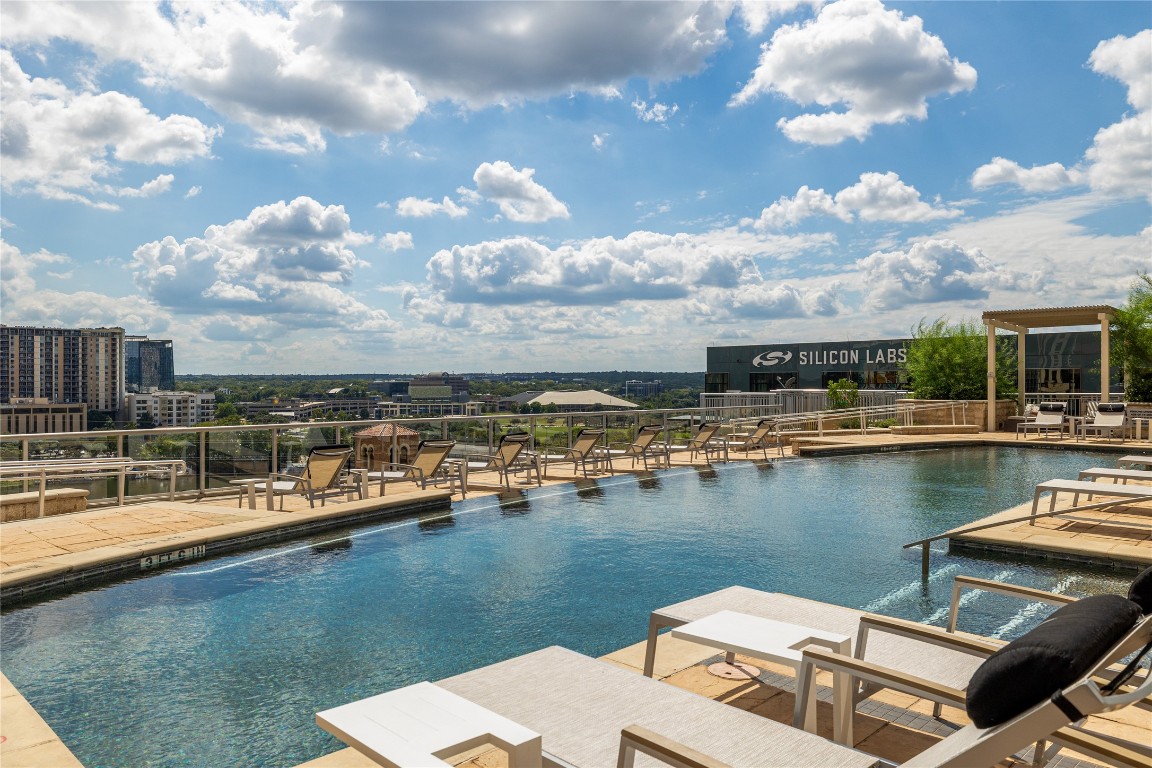 101 Colorado Street, Unit 2601 Austin, TX 78701 - Photo 12 of 12 a view of a lake with a table and chairs