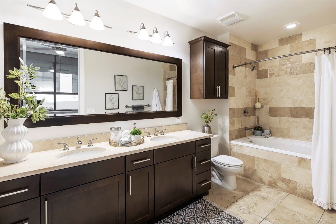 101 Colorado Street, Unit 2601 Austin, TX 78701 - Photo 7 of 12 a bathroom with a toilet sink double vanity and mirror