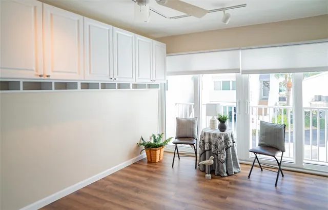 a bedroom with bed and a large window