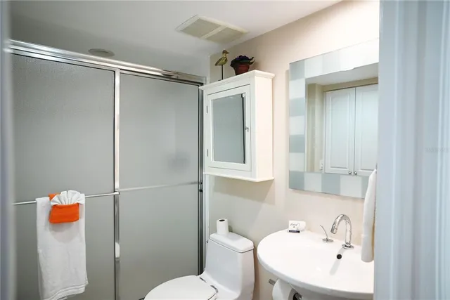 a bedroom with a large bed and a large window