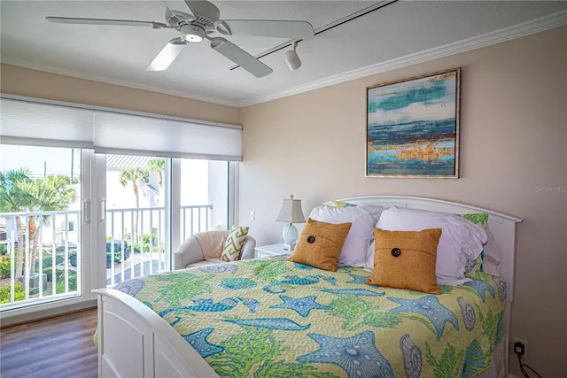 a bedroom with a bed and a large mirror