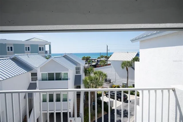 a view of a house with sitting area and swimming pool
