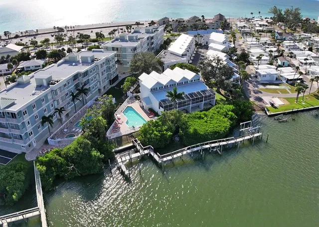 a kitchen with a sink stove and refrigerator
