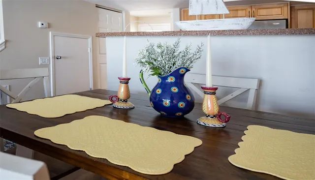 a living room with furniture and large windows