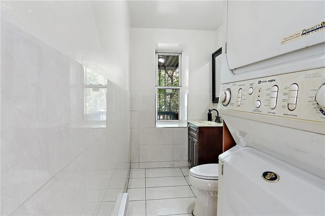 3121 Corlear Avenue Bronx, NY 10463 - Photo 2 of 28 main floor 1/2 bath with washer and dryer