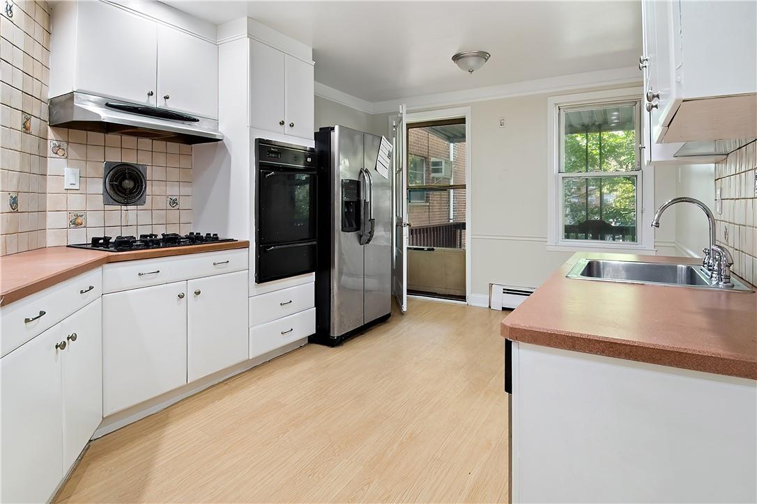 3121 Corlear Avenue Bronx, NY 10463 - Photo 3 of 28 main fl kitchen leads to deck