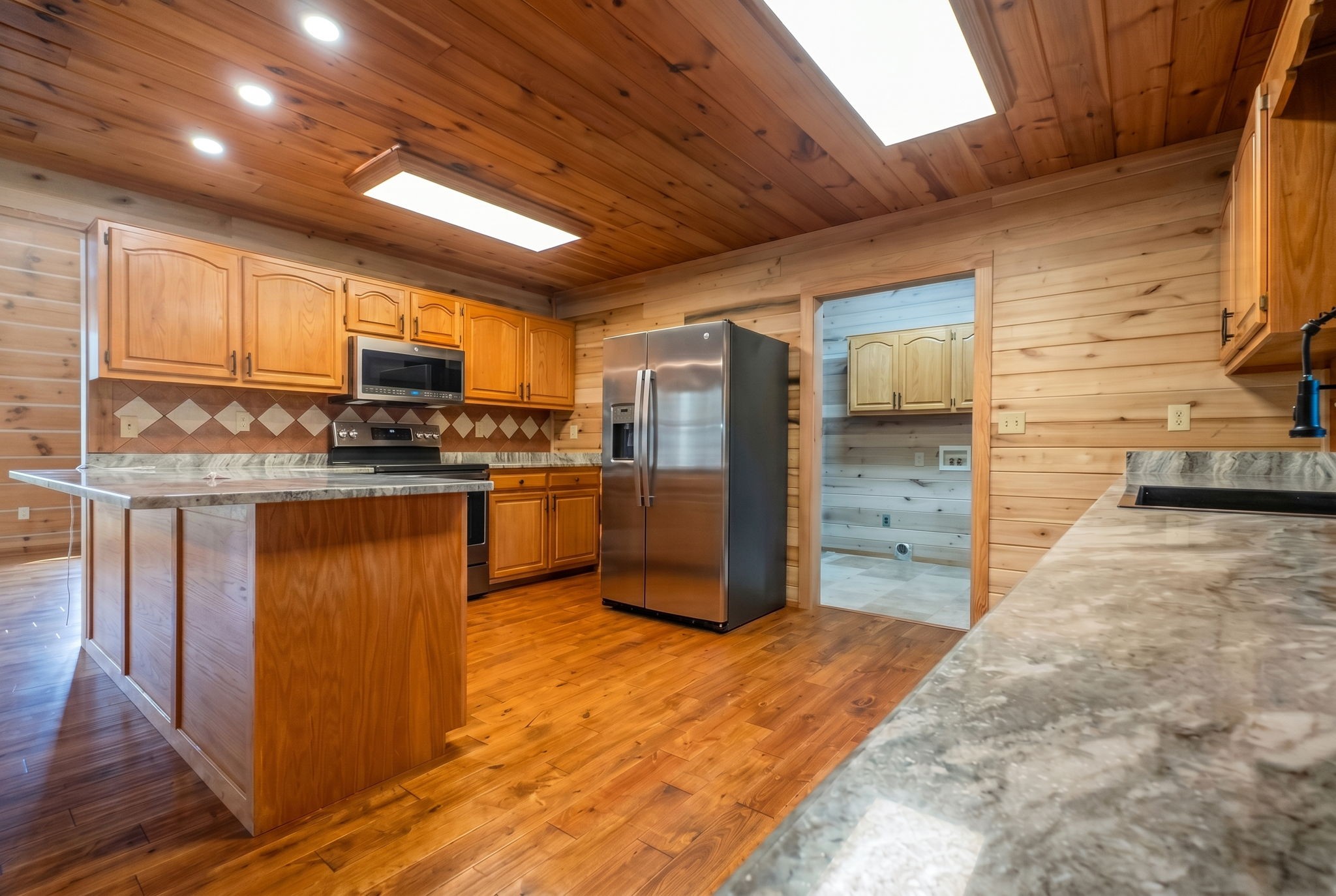 2909 B Beech Log Road Watertown, TN 37184 - Photo 9 of 67 a kitchen with stainless steel appliances granite countertop a refrigerator stove and sink