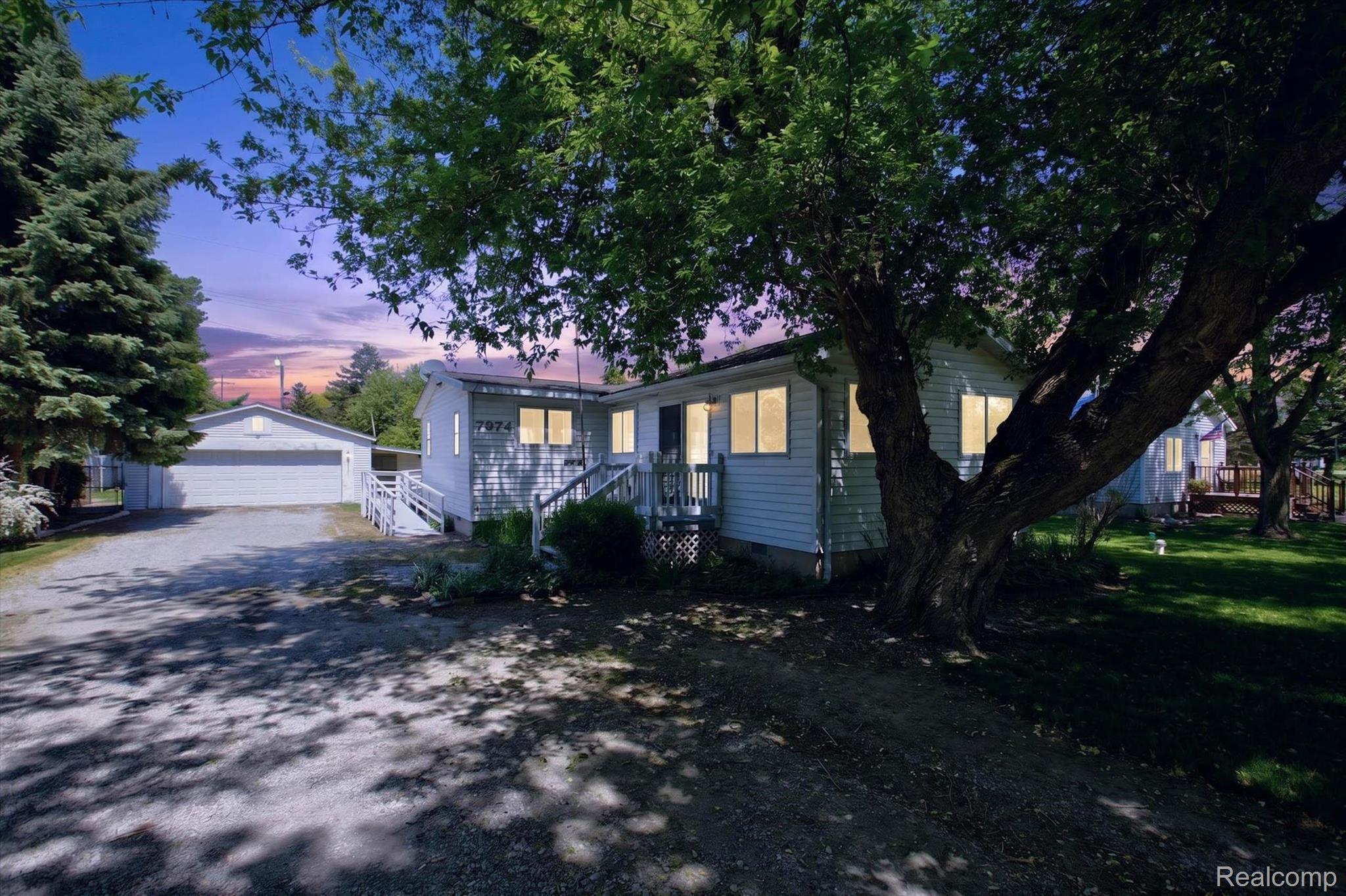 View of front of house with an outbuilding, a garage, and crawl space