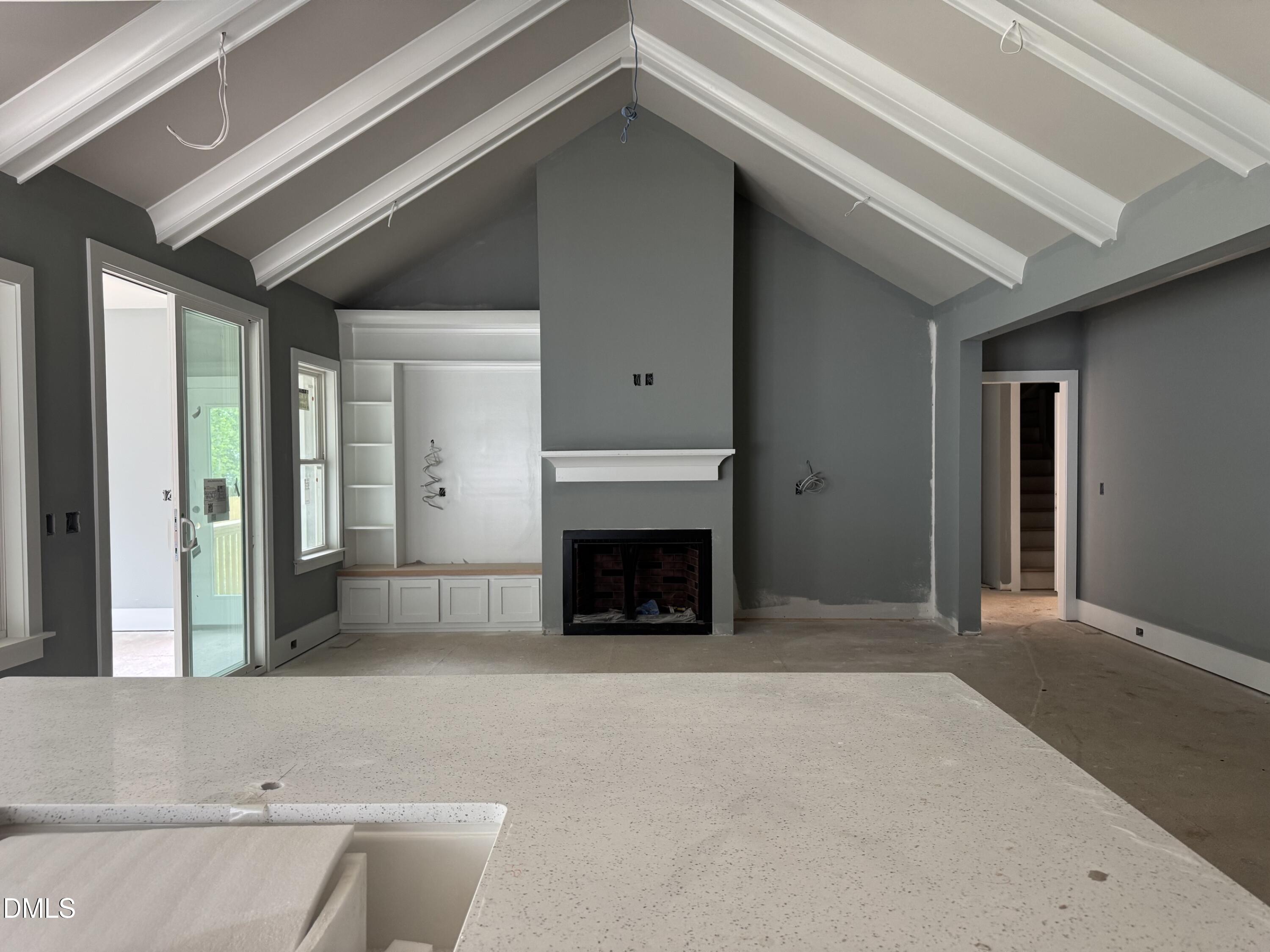935 Lynch Road Selma, NC 27576 - Photo 6 of 21 a view of a livingroom with an empty space and fire place