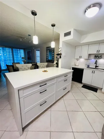 a kitchen with a cabinets and counter space