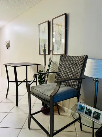 a view of a dining room with furniture and a window