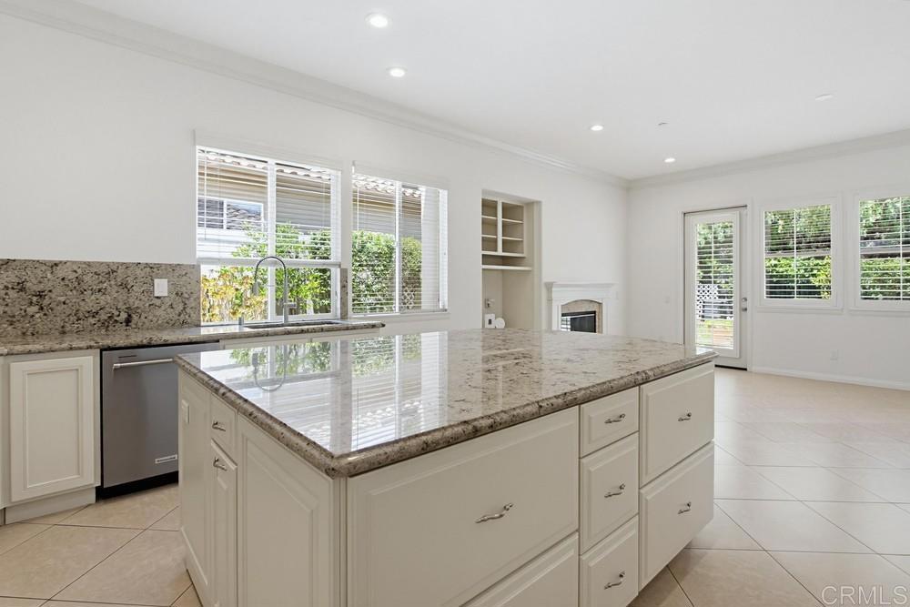 672 Inverlochy Drive Fallbrook, CA 92028 - Photo 22 of 75 a kitchen with granite countertop a sink and a window
