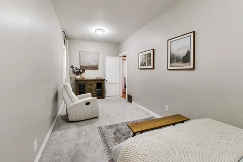 a bedroom with a bed and furniture