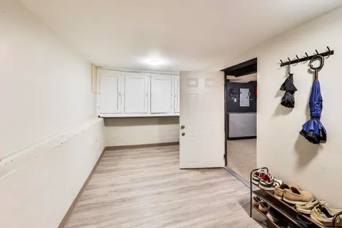 a view of room with closet and wooden floor