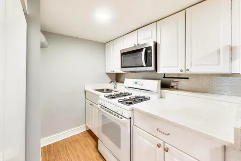 a kitchen with a stove and a microwave
