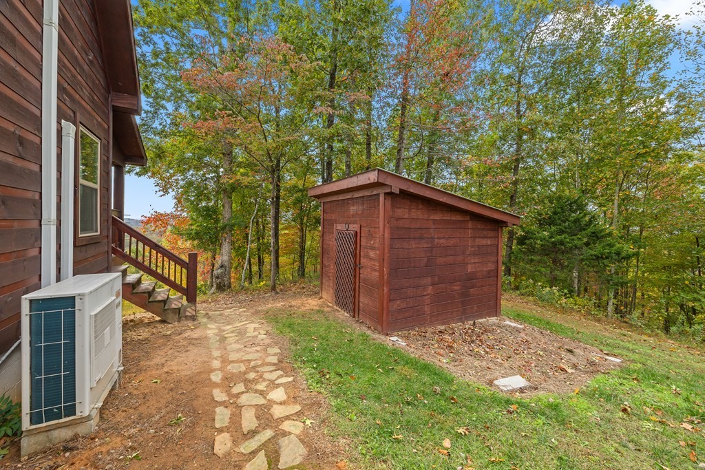604 Hickory Hilham, TN 38568 - Photo 9 of 38 a view of a backyard with barn and wooden fence
