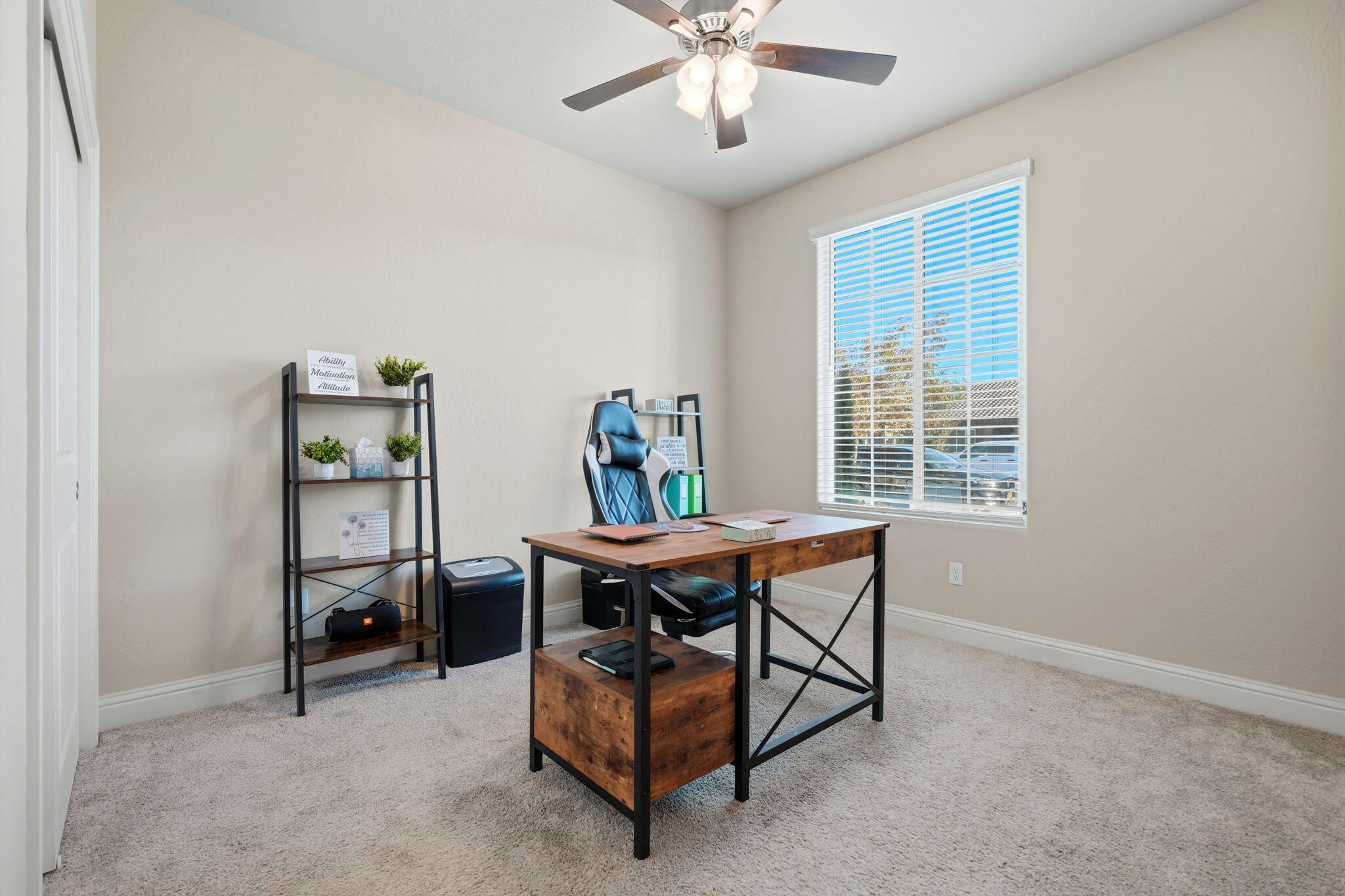 756 Strada Street Lemoore, CA 93245 - Photo 5 of 53 a view of a workspace with furniture and a window