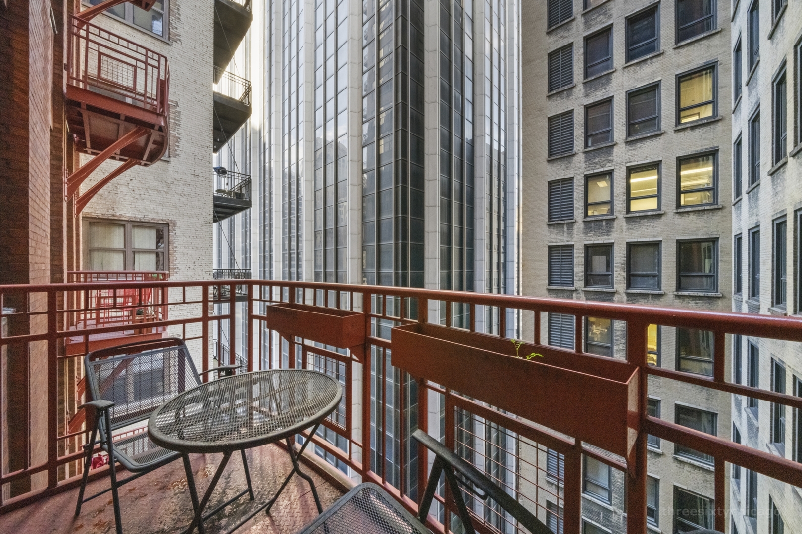 208 West Washington Street, Unit 1002 Chicago, IL 60606 - Photo 12 of 16 a view of a brick building from a balcony