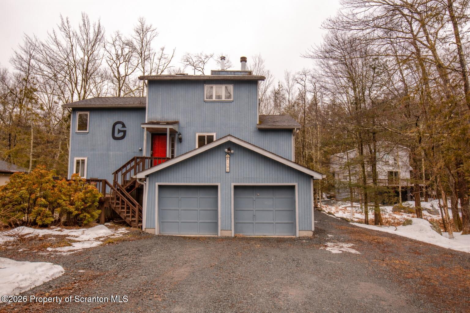 1290 Brookfield Road Lake Ariel, PA 18436 - Photo 2 of 47 a front view of a house with a yard and garage