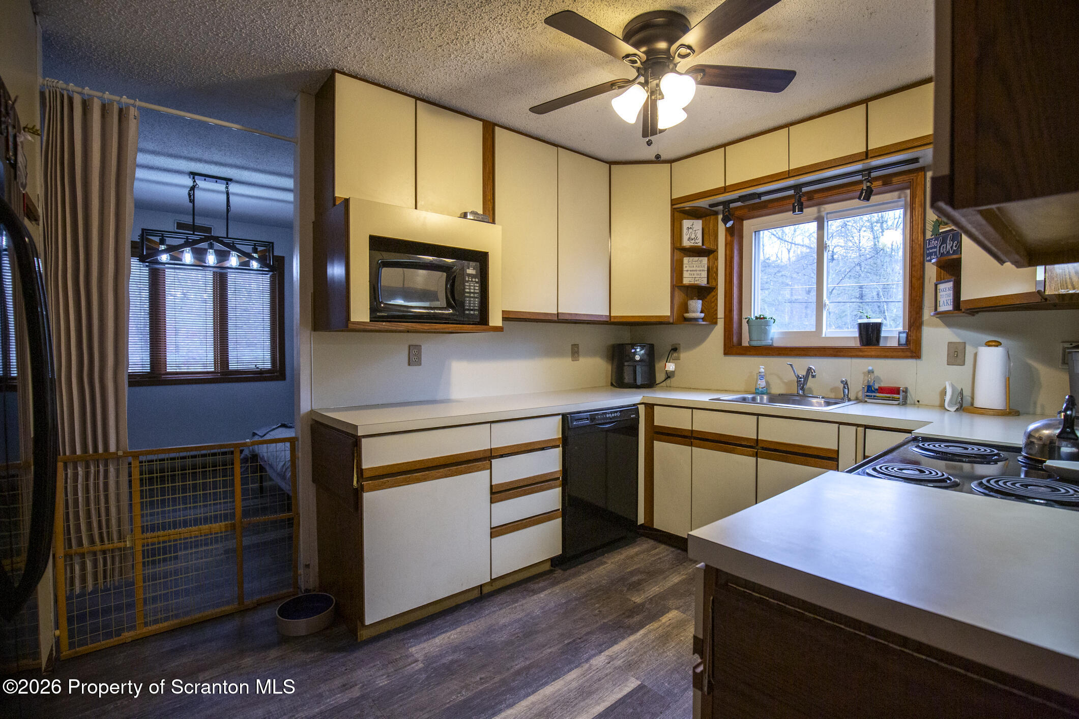 1290 Brookfield Road Lake Ariel, PA 18436 - Photo 21 of 47 a kitchen with stainless steel appliances kitchen island granite countertop a stove a sink and a microwave