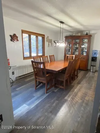 a dining room with furniture and window