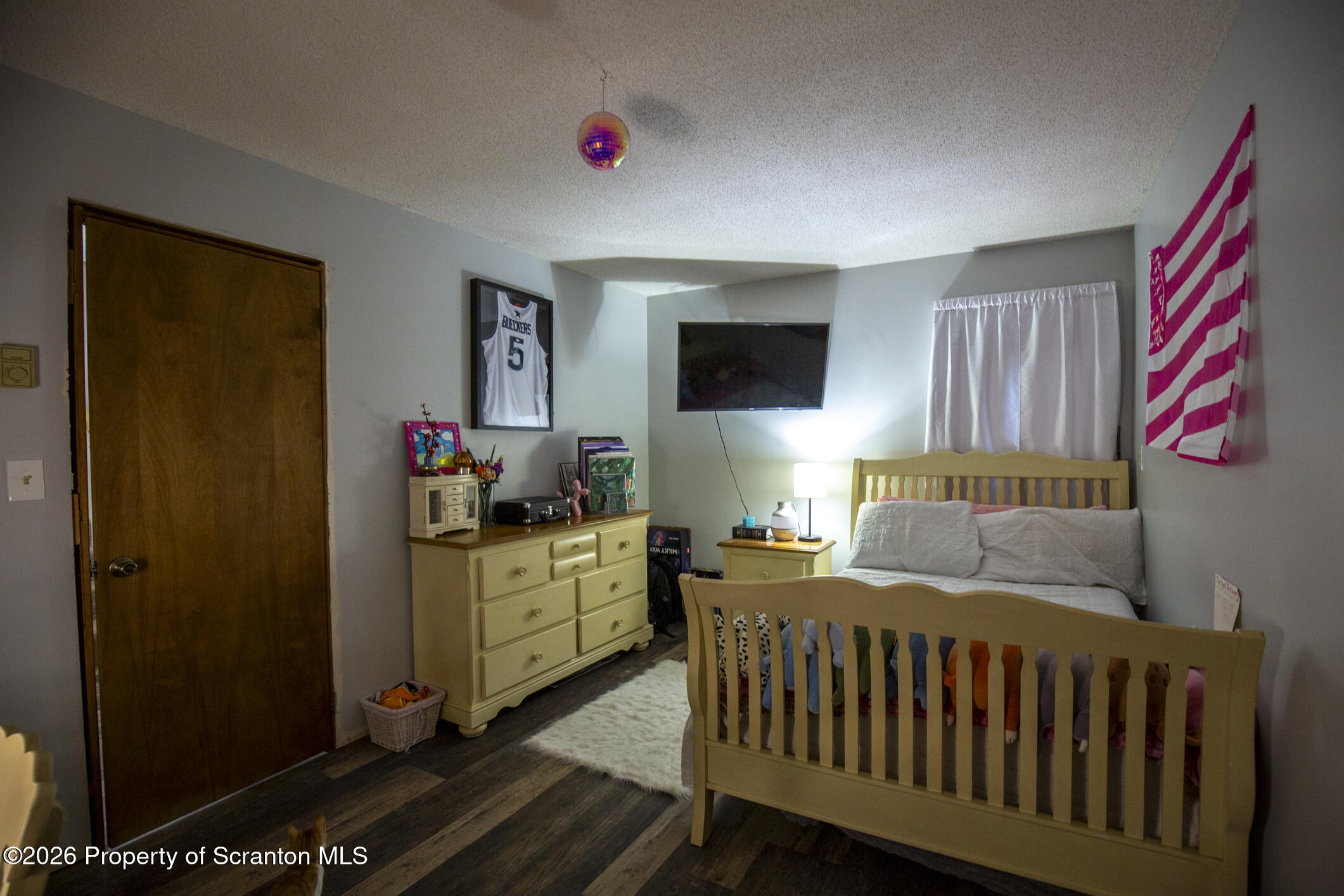 1290 Brookfield Road Lake Ariel, PA 18436 - Photo 25 of 47 a bedroom with a bed and a flat screen tv