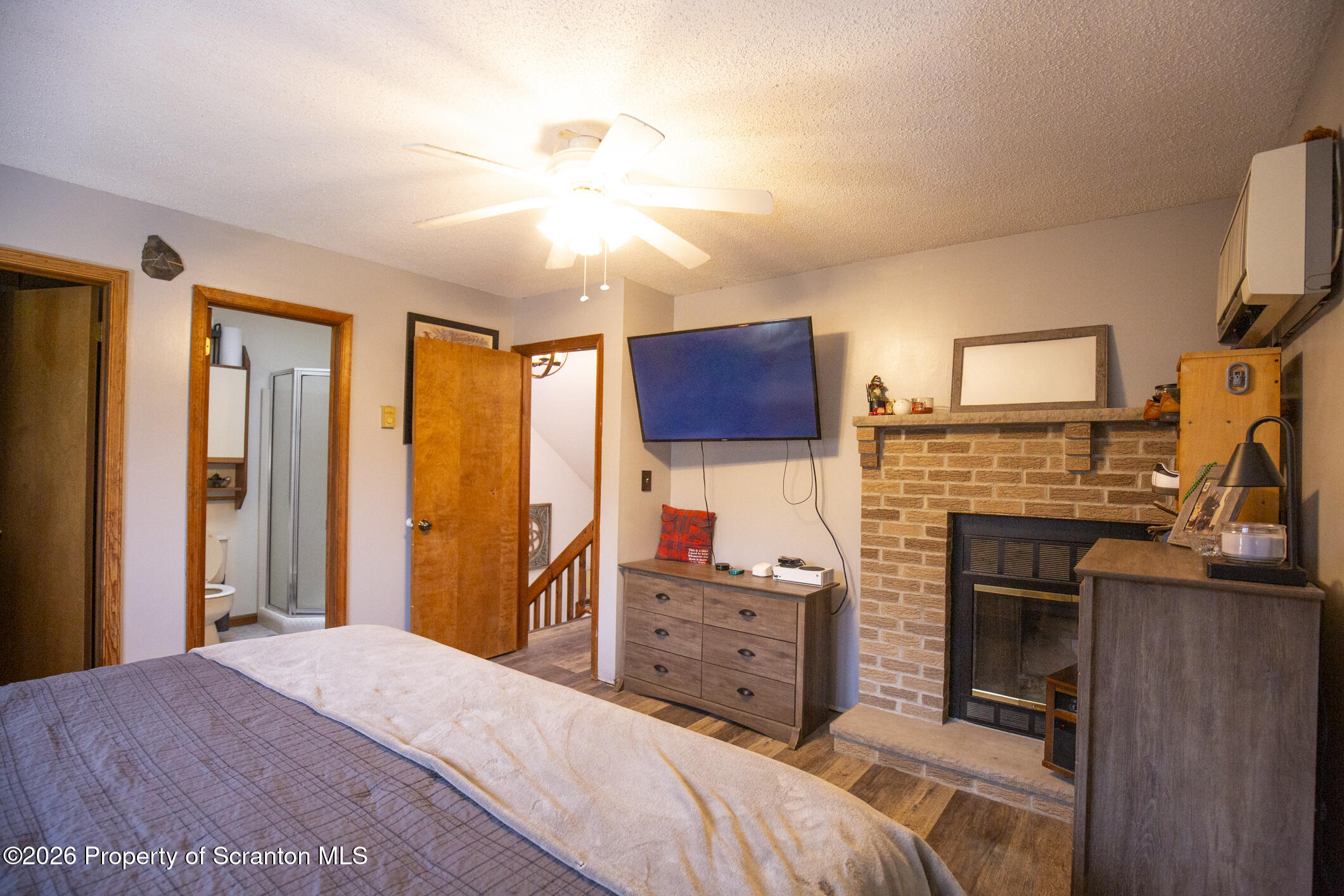 1290 Brookfield Road Lake Ariel, PA 18436 - Photo 35 of 47 a bedroom with a bed flat screen tv and dresser