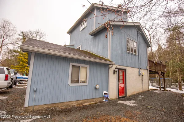 a house with trees in the background