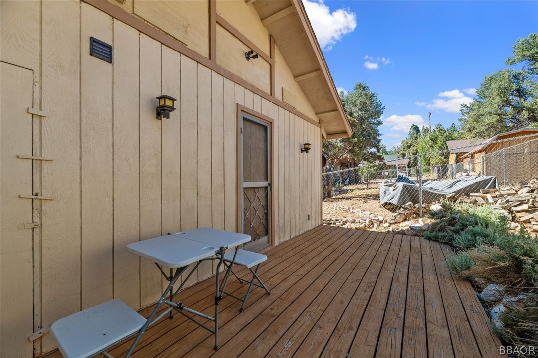 196 Riverside Avenue Sugarloaf, CA 92386 - Photo 29 of 29 a view of balcony with wooden floor and outdoor seating