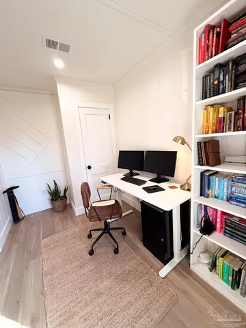 a view of a workspace with furniture