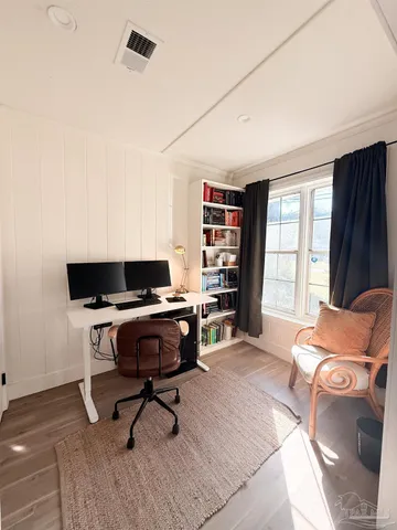 a workspace with furniture and window