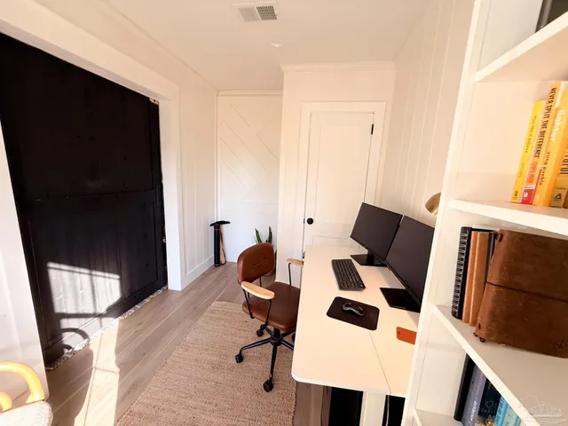 a view of living room with furniture and a window