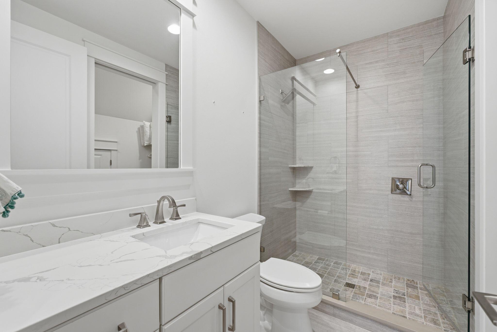133 Sandchase Circle, Unit LOT 15 Inlet Beach, FL 32461 - Photo 29 of 47 a bathroom with a sink a toilet and shower