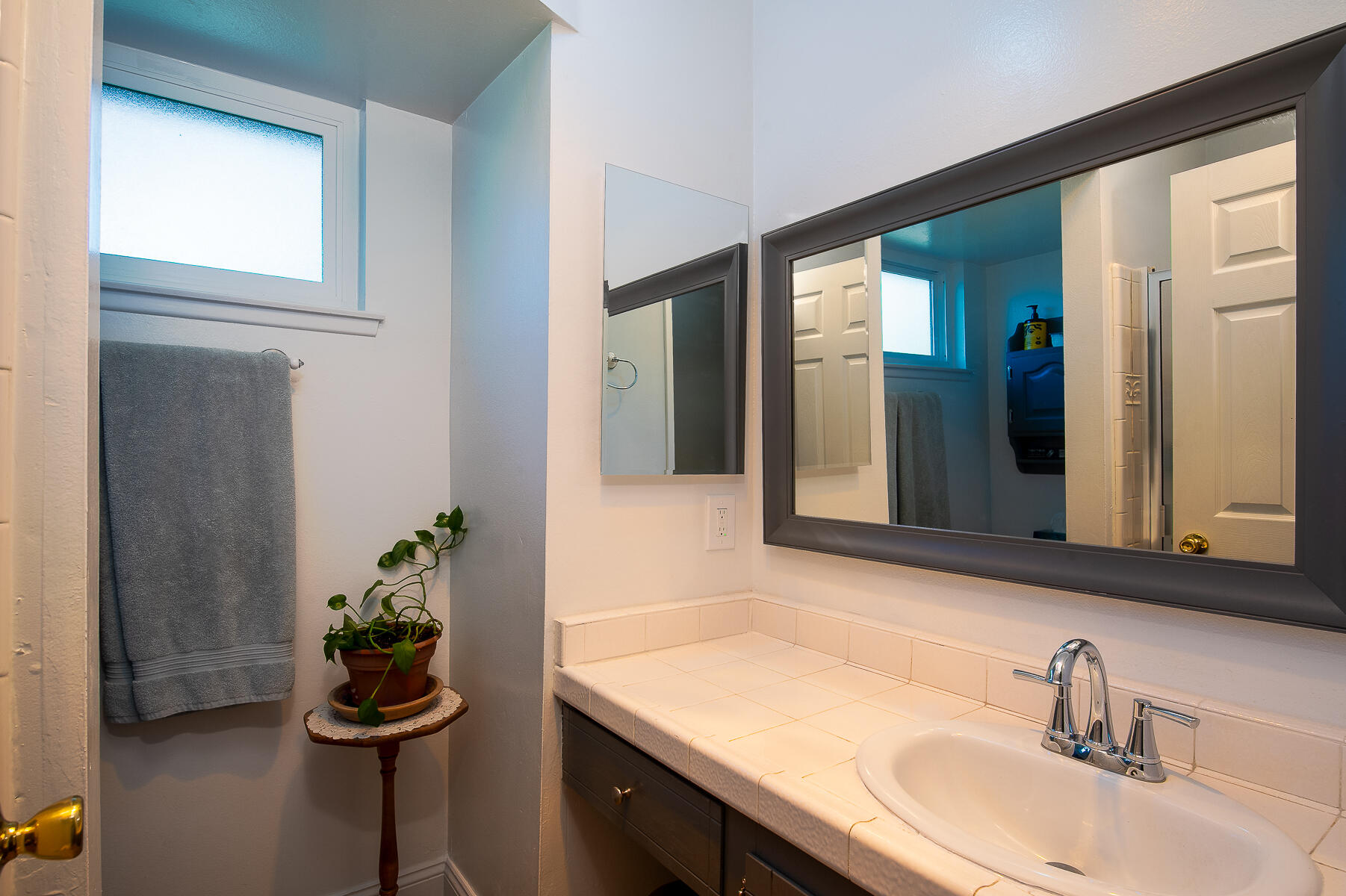 348 Coronado Drive Goleta, CA 93117 - Photo 6 of 21 a bathroom with a sink and a mirror