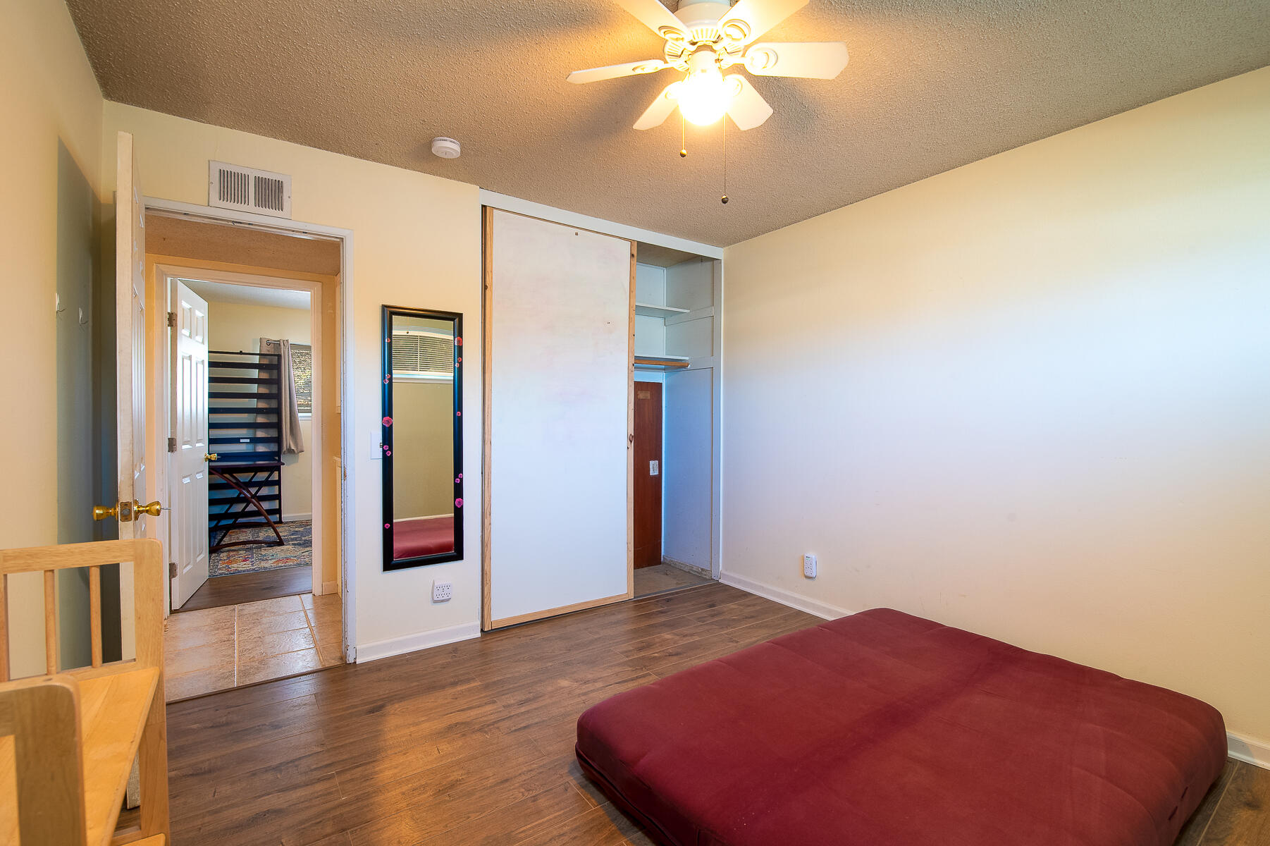 348 Coronado Drive Goleta, CA 93117 - Photo 8 of 21 an empty room with wooden floor closet and windows